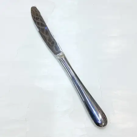 #1084-25; Stainless steel table knife..