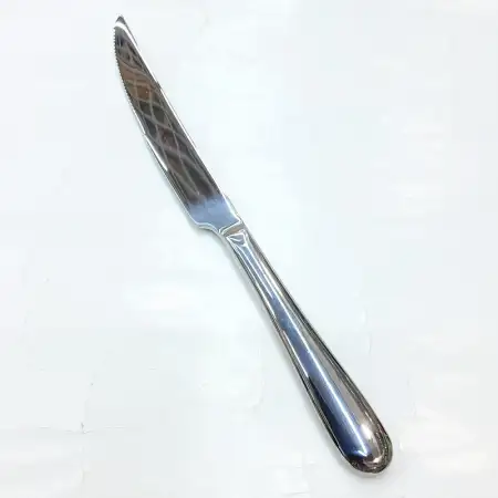 #1084-26; Stainless steel steak knife..