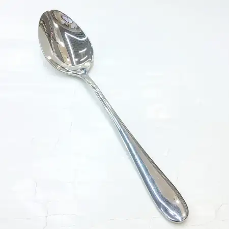 #1084B-13; Stainless steel serving spoon..